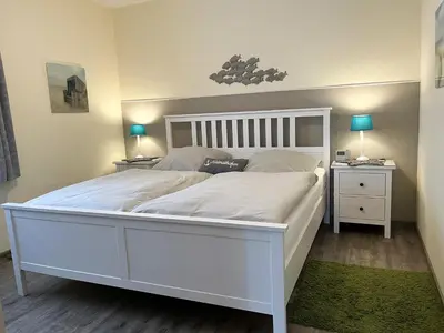 Ein Bett oder Betten in einem Zimmer der Unterkunft Schloss am Meer Whg Meeresflüstern