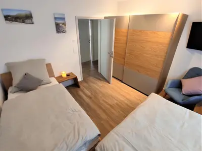 Ein Bett oder Betten in einem Zimmer der Unterkunft Whg Herzenszeit