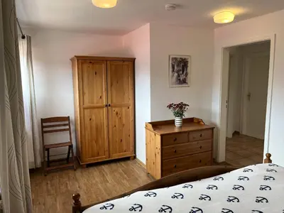 Ein Bett oder Betten in einem Zimmer der Unterkunft Wohnung Alkersum