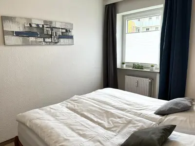Ein Bett oder Betten in einem Zimmer der Unterkunft Wattperle