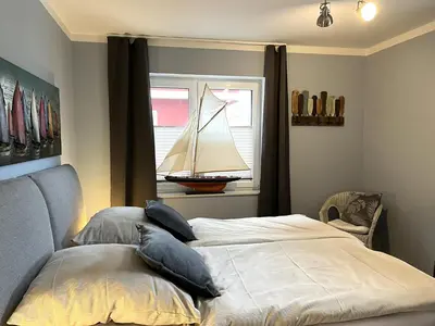 Ein Bett oder Betten in einem Zimmer der Unterkunft Spinnaker