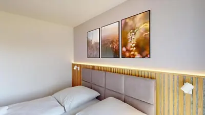 Ein Bett oder Betten in einem Zimmer der Unterkunft Lighthouse Duhner Spitze - W02