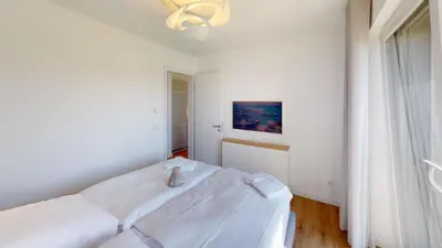 Ein Bett oder Betten in einem Zimmer der Unterkunft Lighthouse Duhner Spitze - W05
