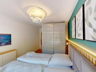 Ein Bett oder Betten in einem Zimmer der Unterkunft Lighthouse Duhner Spitze - W05