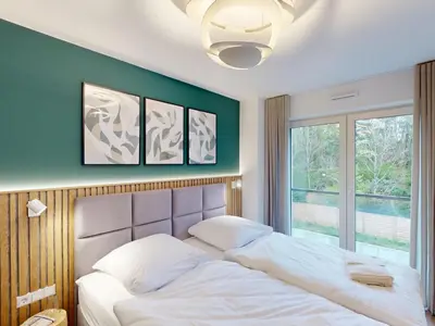 Ein Bett oder Betten in einem Zimmer der Unterkunft Lighthouse Duhner Spitze - W09