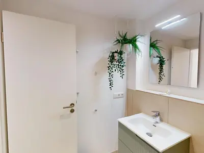 Ein Badezimmer in der Unterkunft Lighthouse Duhner Spitze - W10