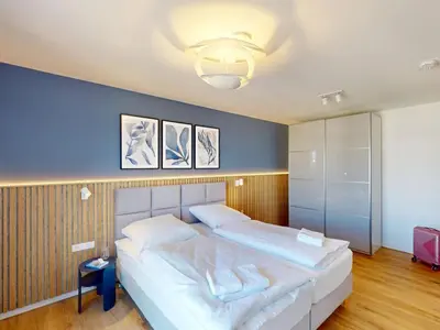 Ein Bett oder Betten in einem Zimmer der Unterkunft Lighthouse Duhner Spitze - W11