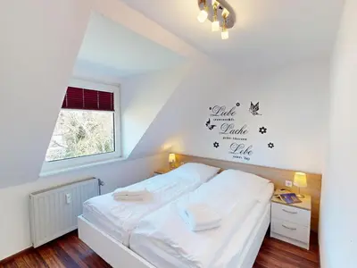 Ein Bett oder Betten in einem Zimmer der Unterkunft Gorch Fock - 11