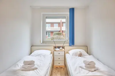 Ein Bett oder Betten in einem Zimmer der Unterkunft Ernst-Gock-Weg 53