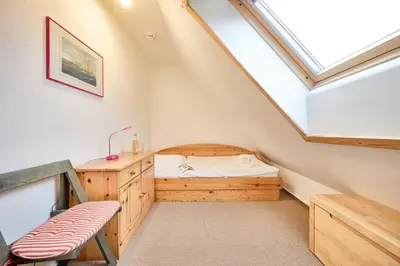 Ein Bett oder Betten in einem Zimmer der Unterkunft Stranddüne - 4