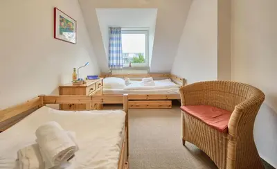 Ein Bett oder Betten in einem Zimmer der Unterkunft Stranddüne - 4