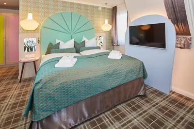 Ein Bett oder Betten in einem Zimmer der Unterkunft Bernstein Hotel 