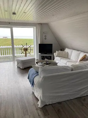 Ein Bett oder Betten in einem Zimmer der Unterkunft Meerblick - Ferienwohnung mit Blick über den Deich