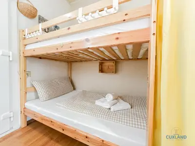 Ein Bett oder Betten in einem Zimmer der Unterkunft Ferienwohnung Kehrwieder Nr 8