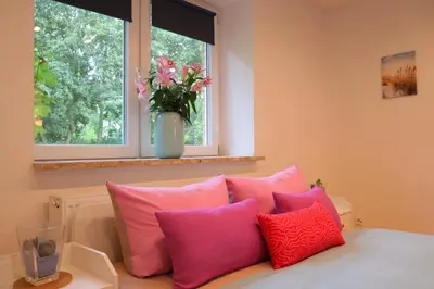 Ein Bett oder Betten in einem Zimmer der Unterkunft Ferienwohnung Am Deich
