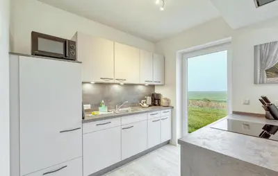 Küche/Küchenzeile in der Unterkunft Modernes Ferienhaus Mit Sauna