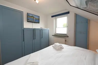 Ein Bett oder Betten in einem Zimmer der Unterkunft Latje Batje Büsum