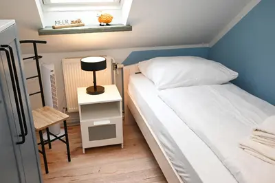 Ein Bett oder Betten in einem Zimmer der Unterkunft Latje Batje Büsum