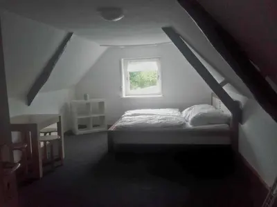 Ein Bett oder Betten in einem Zimmer der Unterkunft HuPes-Ferienhaus