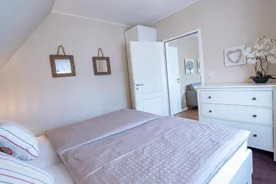Ein Bett oder Betten in einem Zimmer der Unterkunft Haus Hollmann