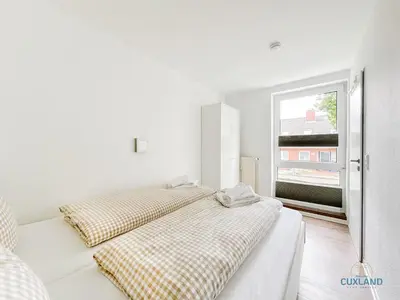Ein Bett oder Betten in einem Zimmer der Unterkunft Haus Pavillon Wohnung 5