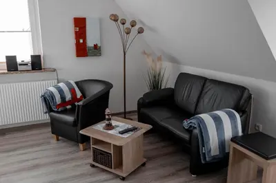Ein Sitzbereich in der Unterkunft Noch ´ne Brise Wohnung 2 Tertius