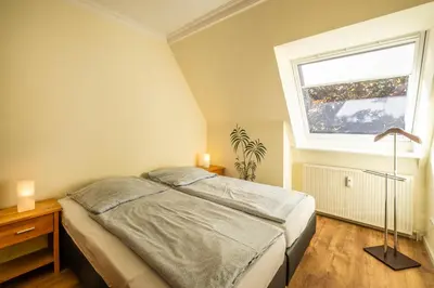 Ein Bett oder Betten in einem Zimmer der Unterkunft Haus Regenpfeifer Wohnung 4