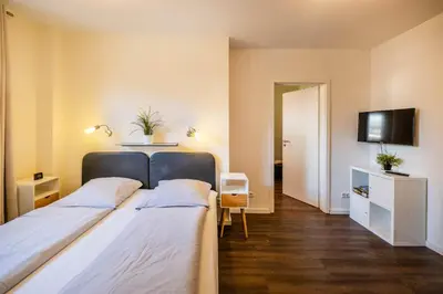 Ein Bett oder Betten in einem Zimmer der Unterkunft Haus Regenpfeifer Wohnung 2