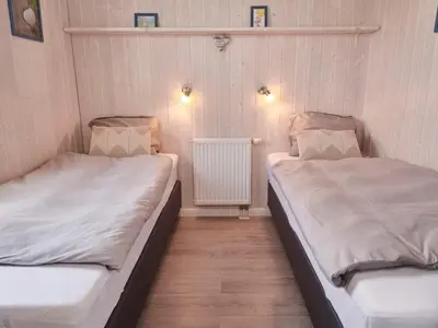 Ein Bett oder Betten in einem Zimmer der Unterkunft 4 star holiday home in FRIEDRICHKOOG