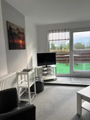 Ein Sitzbereich in der Unterkunft Ferienwohnung Gezeiten