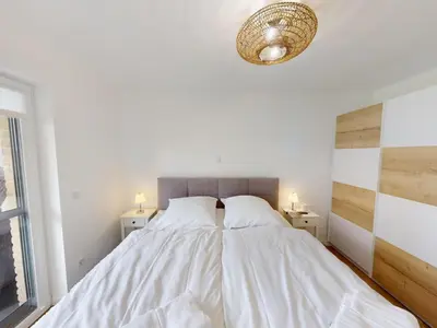 Ein Bett oder Betten in einem Zimmer der Unterkunft Zuhause In Duhnen - 204 Viel Watt