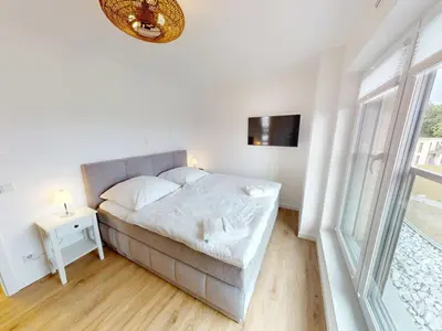 Ein Bett oder Betten in einem Zimmer der Unterkunft Zuhause In Duhnen - 213 Viel Meer