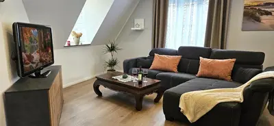 Ein Sitzbereich in der Unterkunft Ferienwohnung Drei Eichen