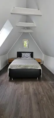 Ein Bett oder Betten in einem Zimmer der Unterkunft Ferienwohnung Drei Eichen