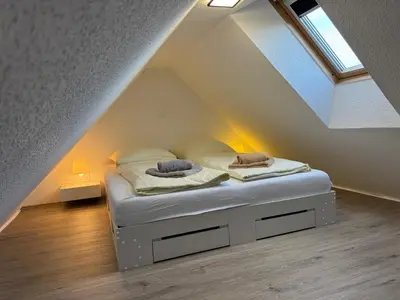 Ein Bett oder Betten in einem Zimmer der Unterkunft Ferienwohnung Altenwalde