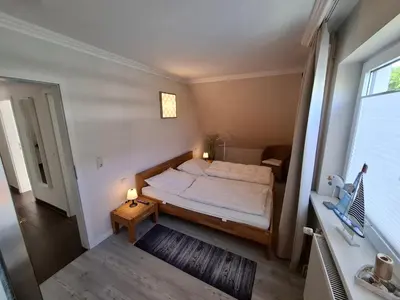 Ein Bett oder Betten in einem Zimmer der Unterkunft Appartement Küstenidyll - Meeresbucht Wohnung 6