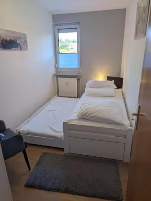 Ein Bett oder Betten in einem Zimmer der Unterkunft Nige Ooge FeWo 9