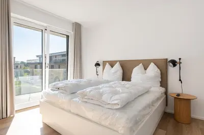 Ein Bett oder Betten in einem Zimmer der Unterkunft Ferienwohnung Meerloft