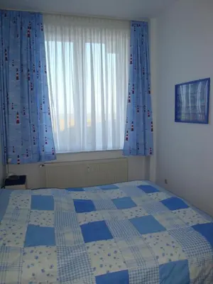 Ein Bett oder Betten in einem Zimmer der Unterkunft Haus Seeterrassen, App 06