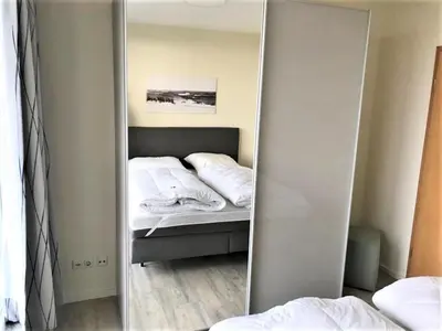Ein Bett oder Betten in einem Zimmer der Unterkunft Haus Nordseeblick, App 13
