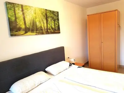 Ein Bett oder Betten in einem Zimmer der Unterkunft Kurpark Residenz, App 104