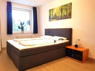 Ein Bett oder Betten in einem Zimmer der Unterkunft Kurpark Residenz, App 104