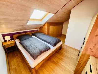 Ein Bett oder Betten in einem Zimmer der Unterkunft Lüttje Deichvilla XL