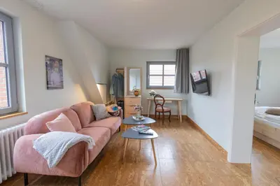 Ein Bett oder Betten in einem Zimmer der Unterkunft Altstadthotel Eibsen