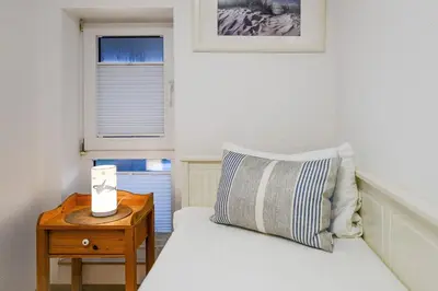 Ein Bett oder Betten in einem Zimmer der Unterkunft Haus Horizont I HZ06