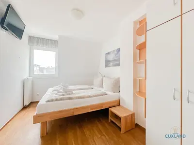 Ein Bett oder Betten in einem Zimmer der Unterkunft Residenz Rugenbargsweg Wohnung 15