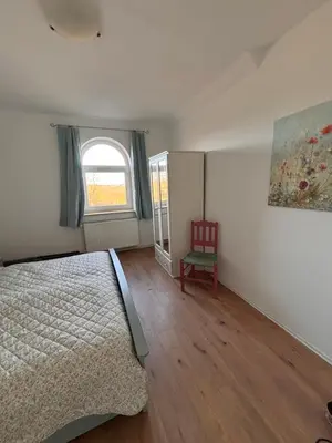 Ein Bett oder Betten in einem Zimmer der Unterkunft Gut Ellernwurth Wremen