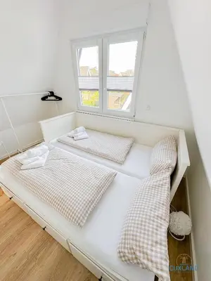 Ein Bett oder Betten in einem Zimmer der Unterkunft Ferienhaus am Ringwall 19