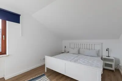 Ein Bett oder Betten in einem Zimmer der Unterkunft haven-apartments Duhnen