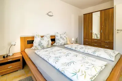 Ein Bett oder Betten in einem Zimmer der Unterkunft Haus am Waldbad AW05